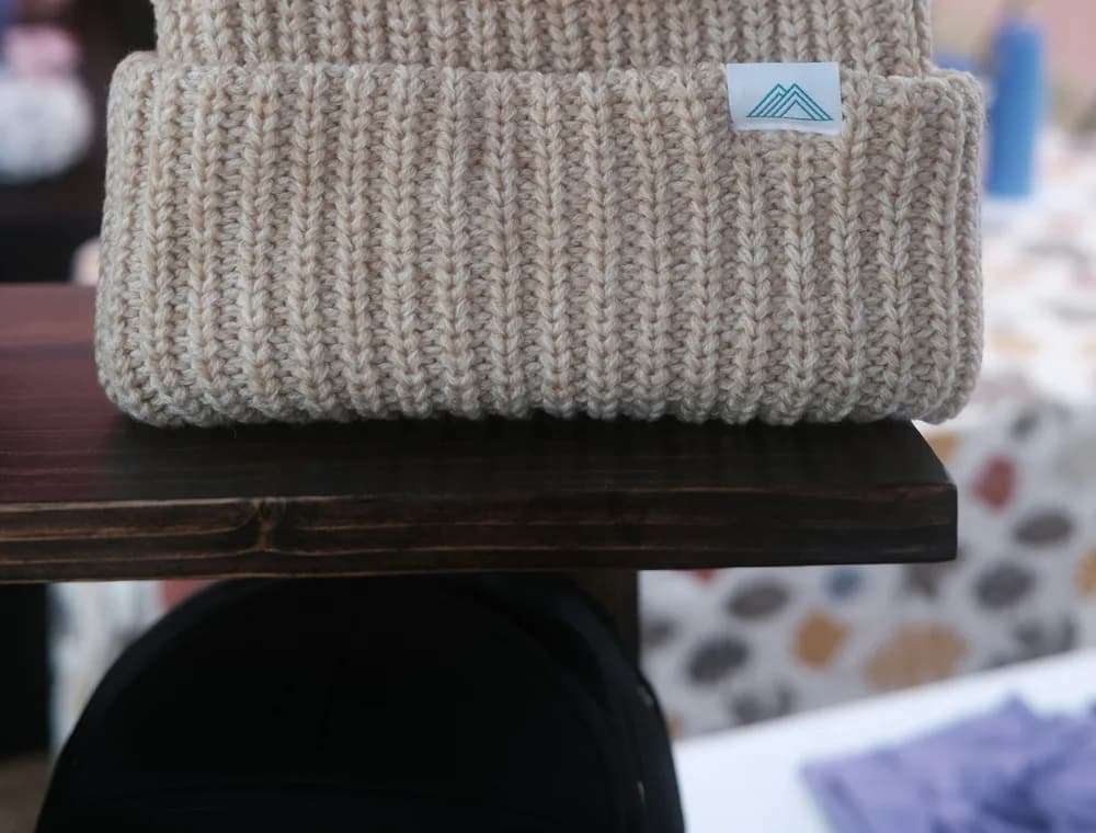 Textured knit beanie demonstrating custom knitwear capability