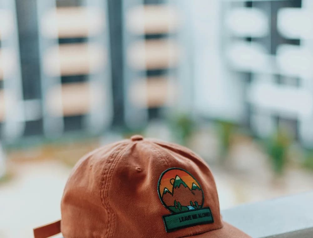 Custom trucker cap showing front-panel embroidery detail